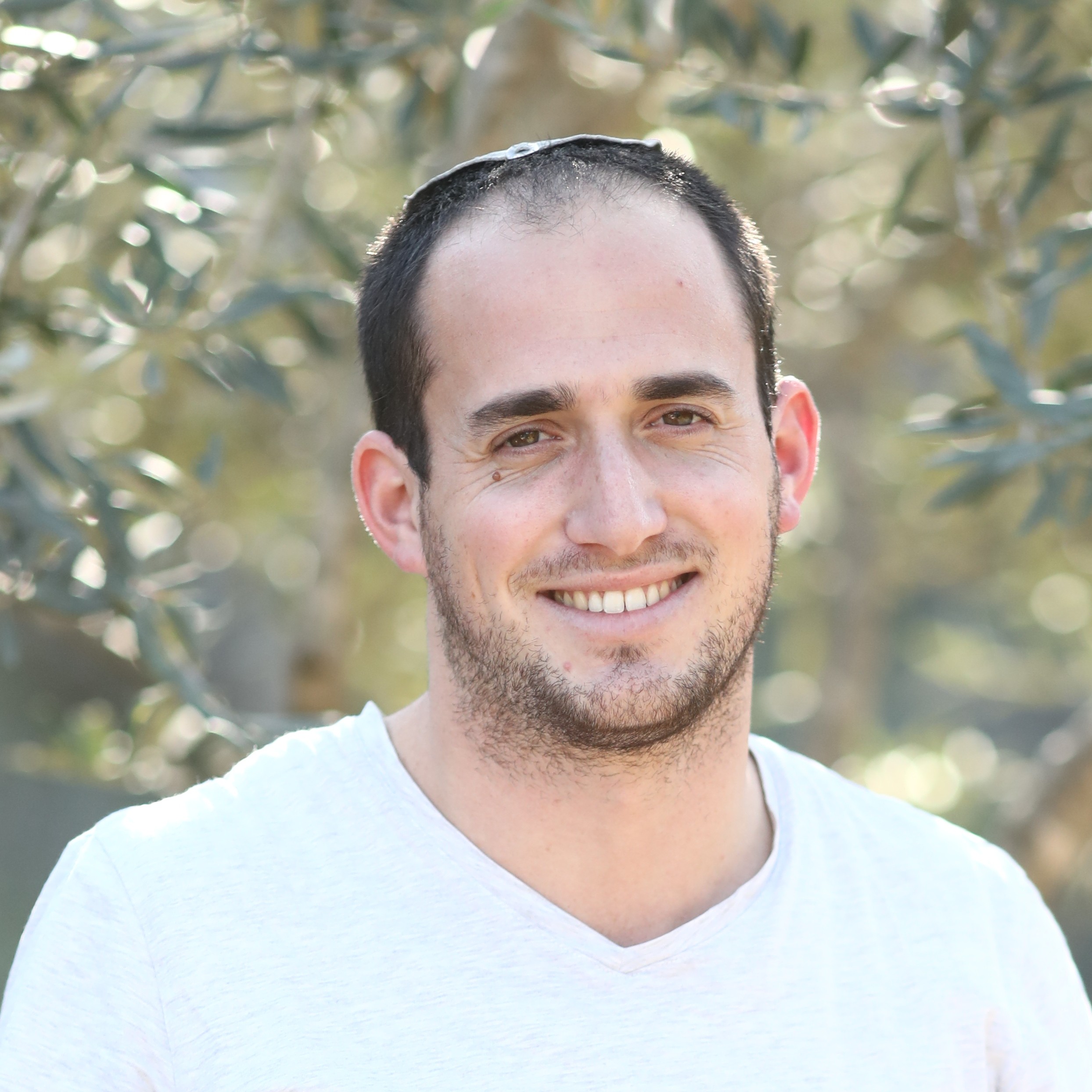 Picture of Yuval Nusan, a young man with short hair.